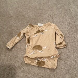 Kate Quinn bird bodysuit